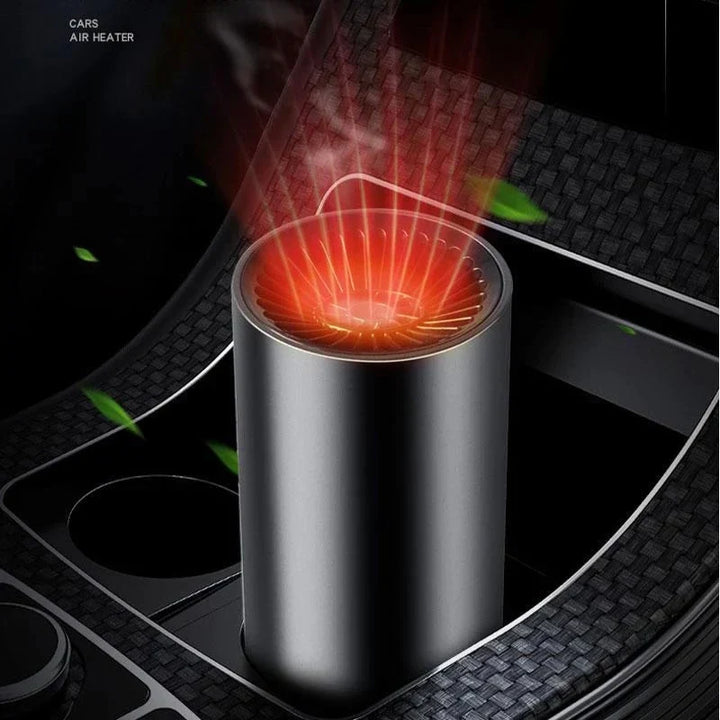 Hand adjusting a portable car heater, circulating warm air for fast winter defogging and vehicle comfort.