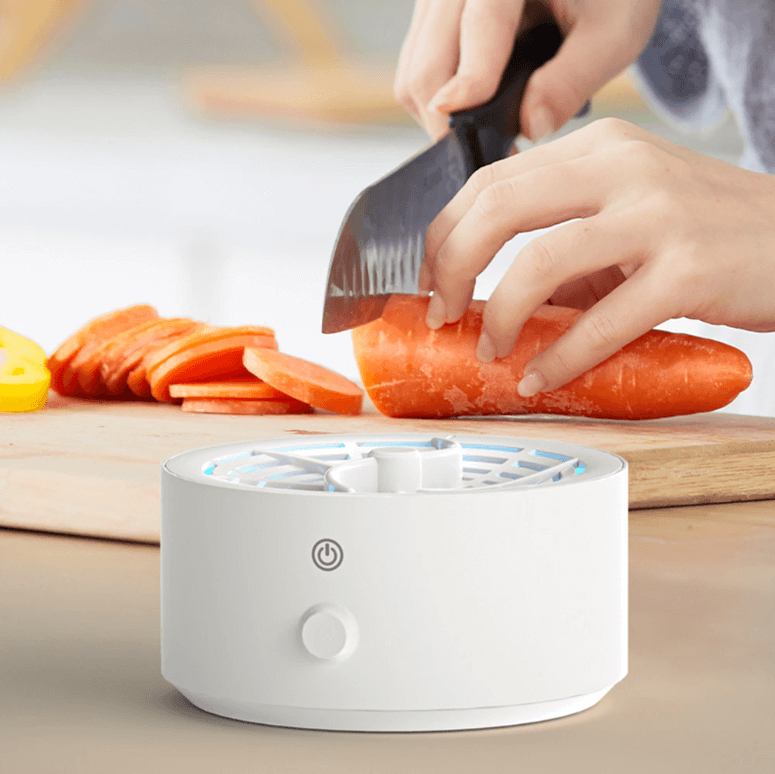 Efficient fruit & vegetable cleaner, a portable kitchen gadget using ionic tech for chemical-free food purification.