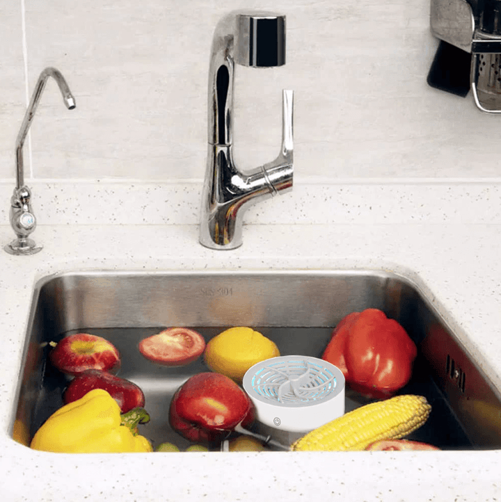 Compact portable produce washer purifying a bowl of fresh fruits & vegetables for healthy, chemical-free eating.