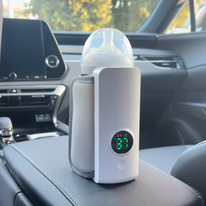 "Portable rechargeable baby bottle warmer with digital display, compact design, BPA-free, USB charging, perfect temperature."