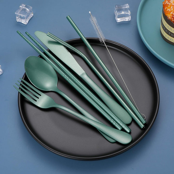Portable stainless steel cutlery set with cleaning brush, perfect for hygienic travel.