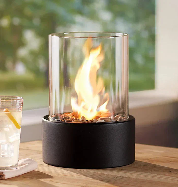 Sleek steel & borosilicate glass tabletop fire pit, a stylish home accent & patio decor.