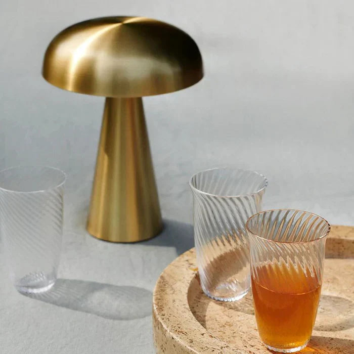 Soft glow ShroomLite LED night light, rechargeable & portable; ideal for serene ambient lighting.