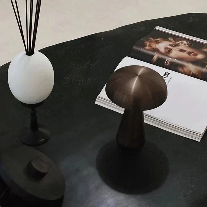 Sleek modern ShroomLite LED lamp, rechargeable, providing elegant cordless ambient light for decor.