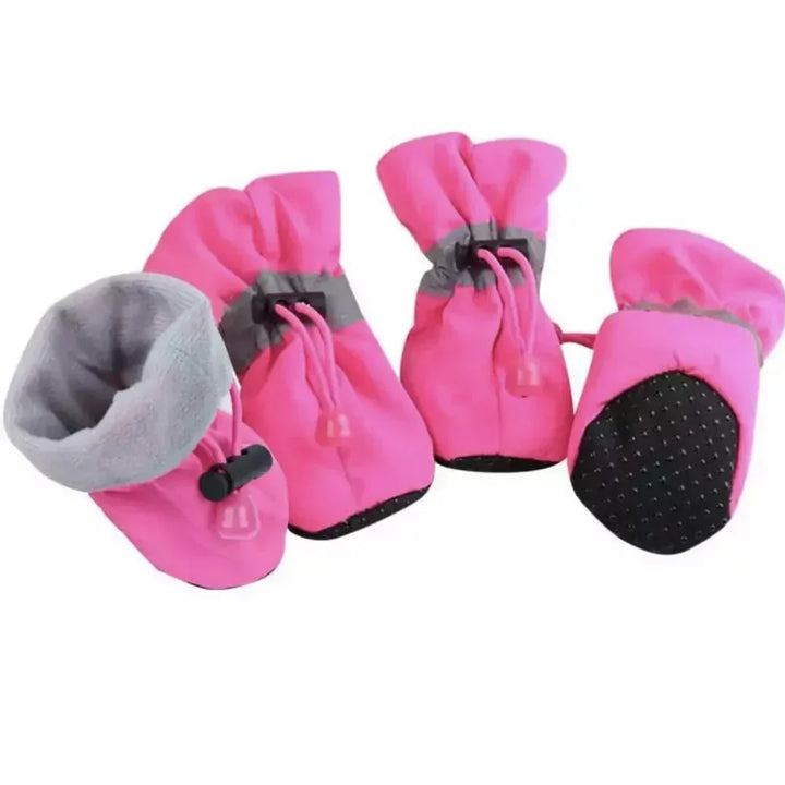 "Red winter dog boots with a non-slip sole, warm lining, and waterproof finish, perfect for cold, wet conditions."