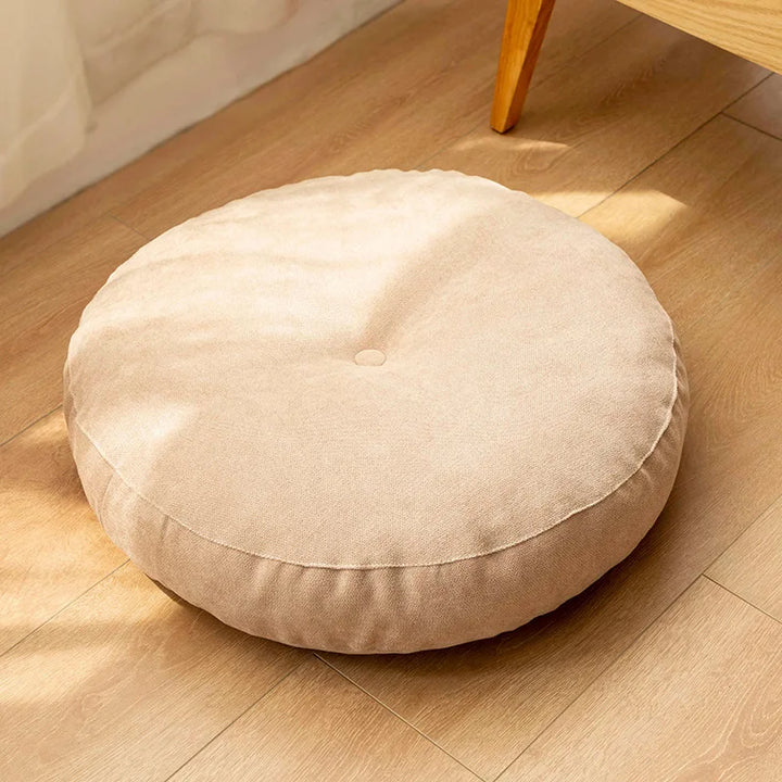 Plush round meditation cushion offers comfortable floor seating for yoga, relaxation & mindful practices.