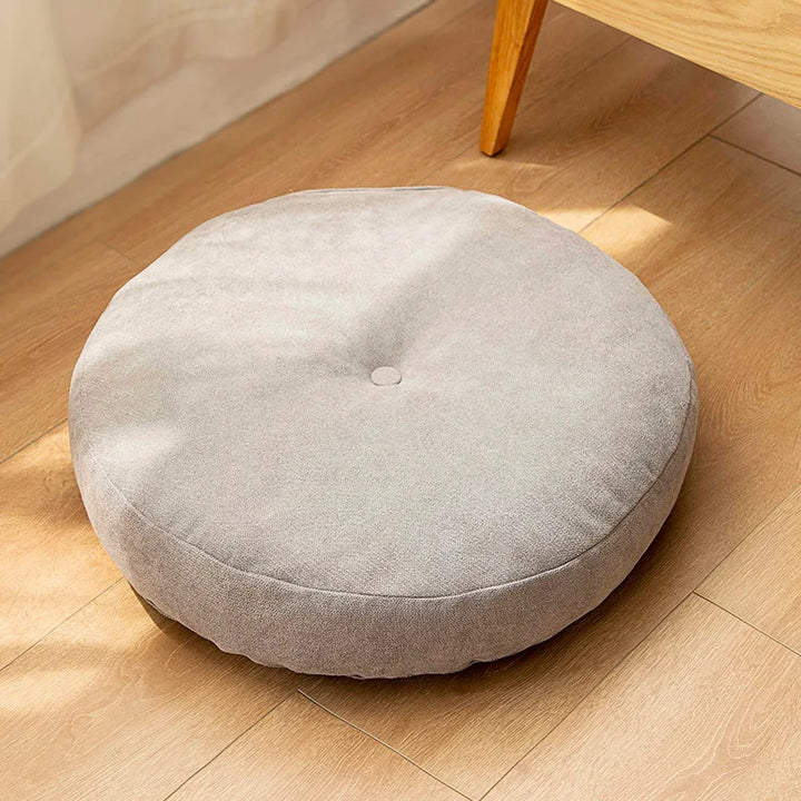 Versatile round meditation and yoga cushion, providing comfort for floor seating & relaxation at home.