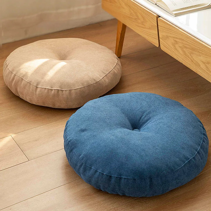Ergonomic round meditation cushion for comfortable floor seating. Supports posture during yoga & mindfulness.