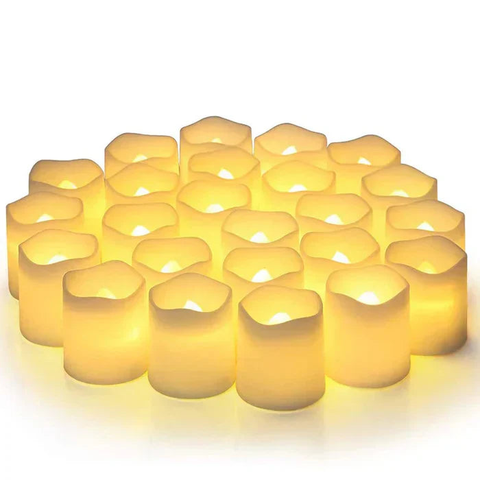 Set of 24 flameless LED candles. Safe, battery-operated warm white light for home decor & events.