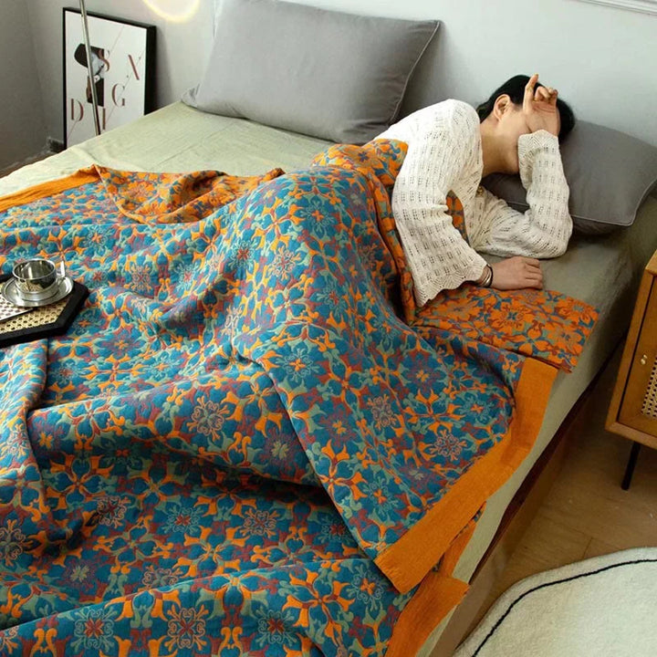 TerraLoom organic cotton quilt, 6-layer design. Stylish orange & blue patterned bedding for a cozy home.