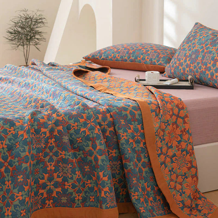 TerraLoom six-layer cotton quilt. Unique orange & blue patterned bedding adds warmth & style to any bedroom.