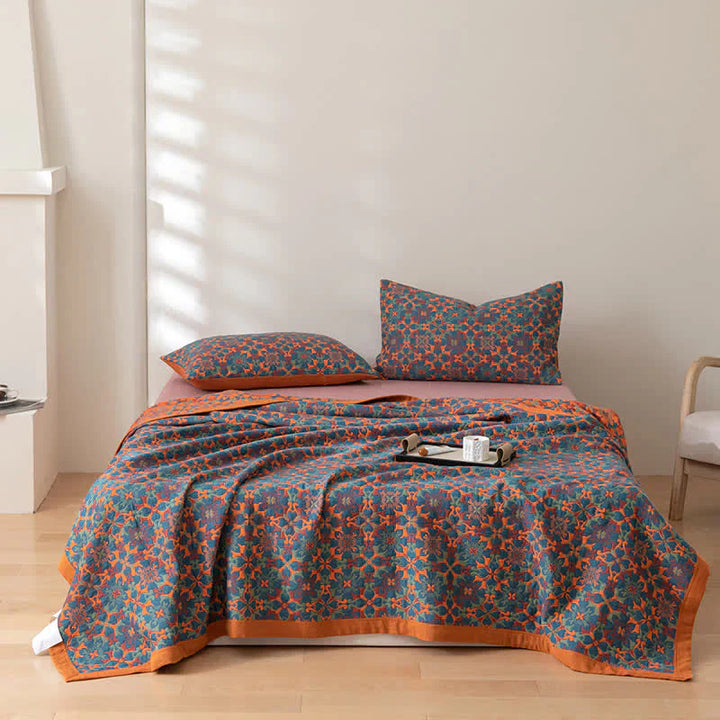 Vivid orange & blue patterned 6-layer cotton quilt. A soft, cozy home textile & stylish addition to bedding.