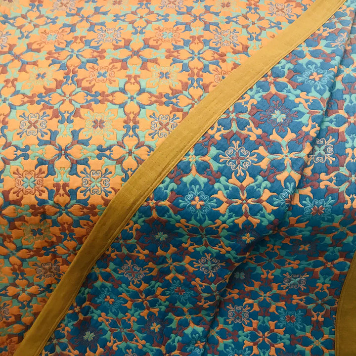 Unisex orange & blue patterned cotton quilt. This soft, 6-layer bedding brings comfort and style to your home.