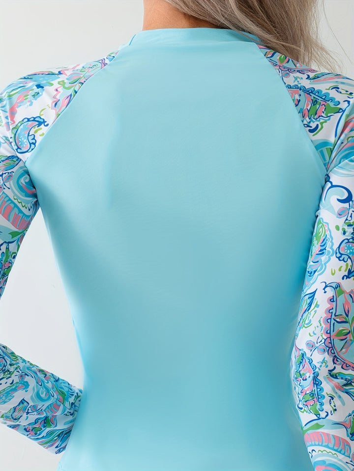 Sky blue women's rash guard swim set, long sleeve top and shorts, providing UV sun protection for women's swimwear.
