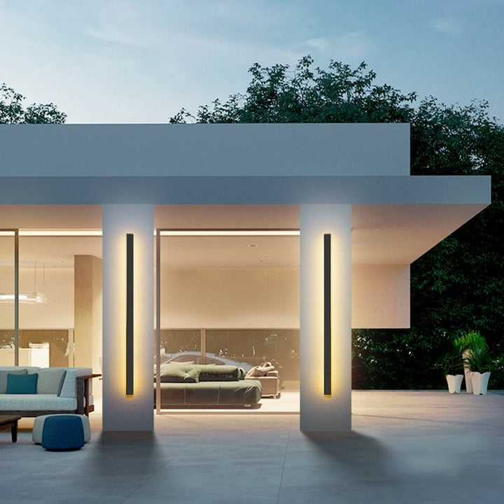 Sleek aluminium outdoor wall sconce with backlit design, ideal for modern patios; corrosion-resistant and stylish.