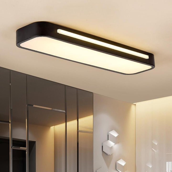 "Sleek minimalist linear LED ceiling light with iron and acrylic design, perfect for modern homes, available in three sizes."
