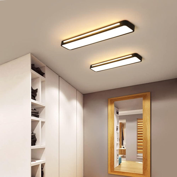 "Sleek minimalist linear LED ceiling light with iron and acrylic design, perfect for modern homes, available in three sizes."