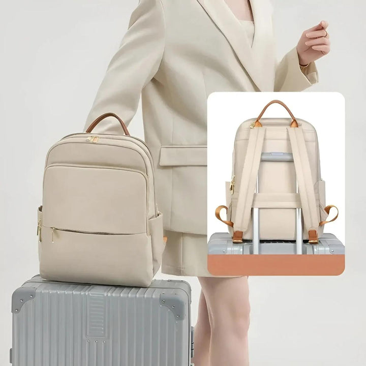 Durable waterproof laptop backpack for women, safeguarding electronics on the go.