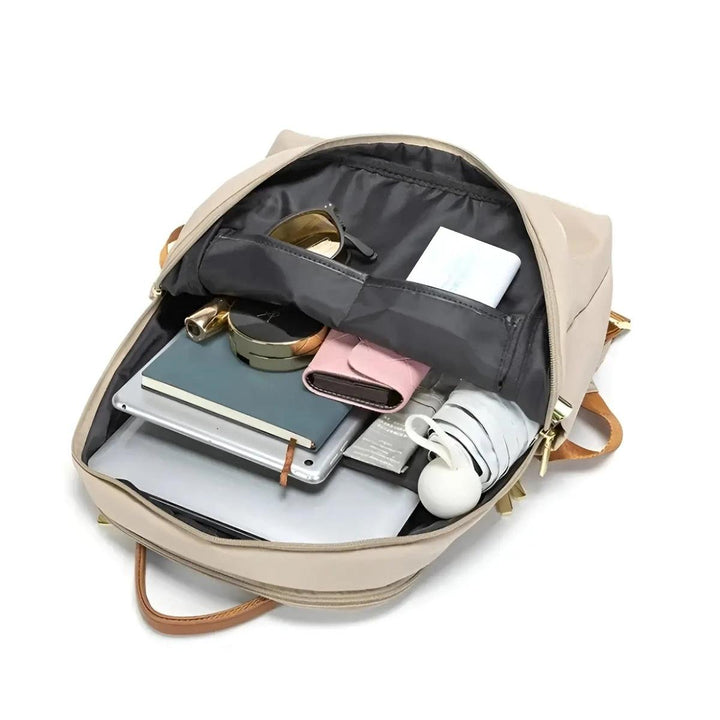 Ergonomic women's laptop backpack, sleek waterproof design for comfortable everyday wear.