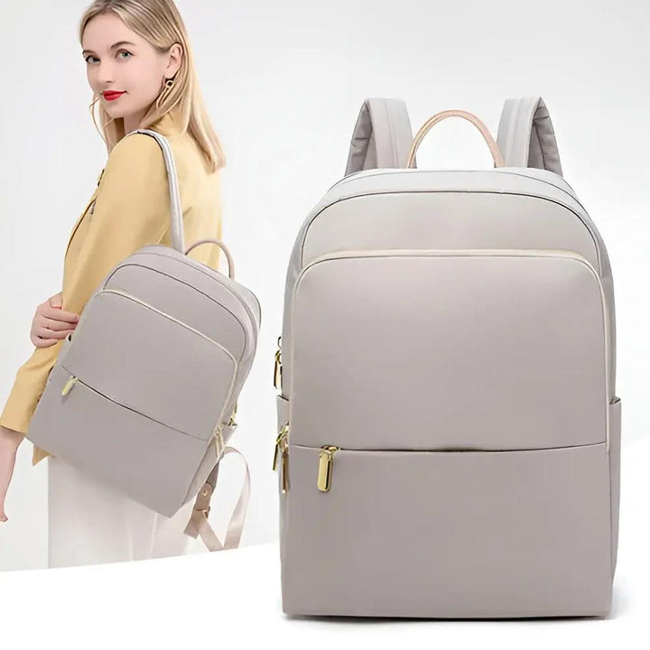Spacious women's waterproof backpack, sleek style for laptops and daily essentials.