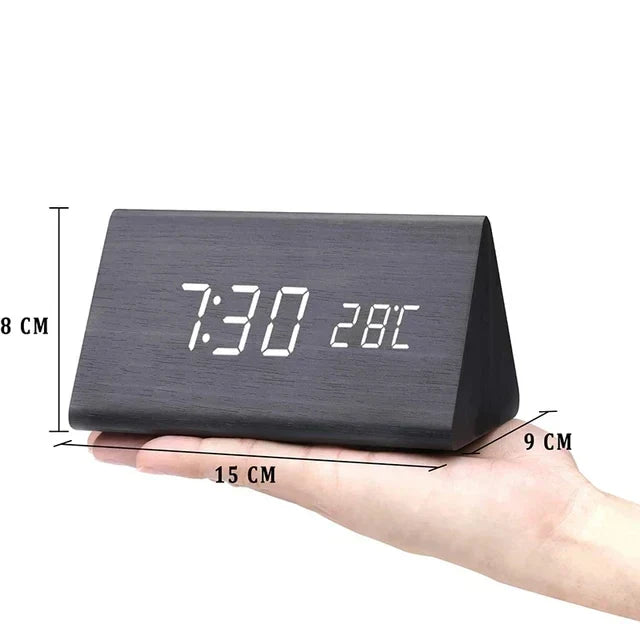Sleek LED alarm clock with voice control, a minimalist design for modern home decor.