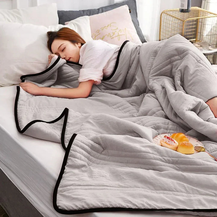 Soft, breathable bamboo fiber & cotton blend cooling blanket for summer comfort. Lightweight bedding for ultimate relaxation.
