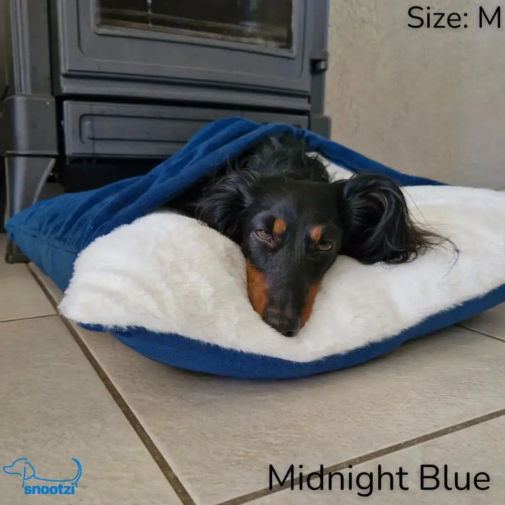 Comfortable pet bed, the CuddleNest Lounger, designed for anxiety relief. A soft, washable dog lounger & cuddler bed.