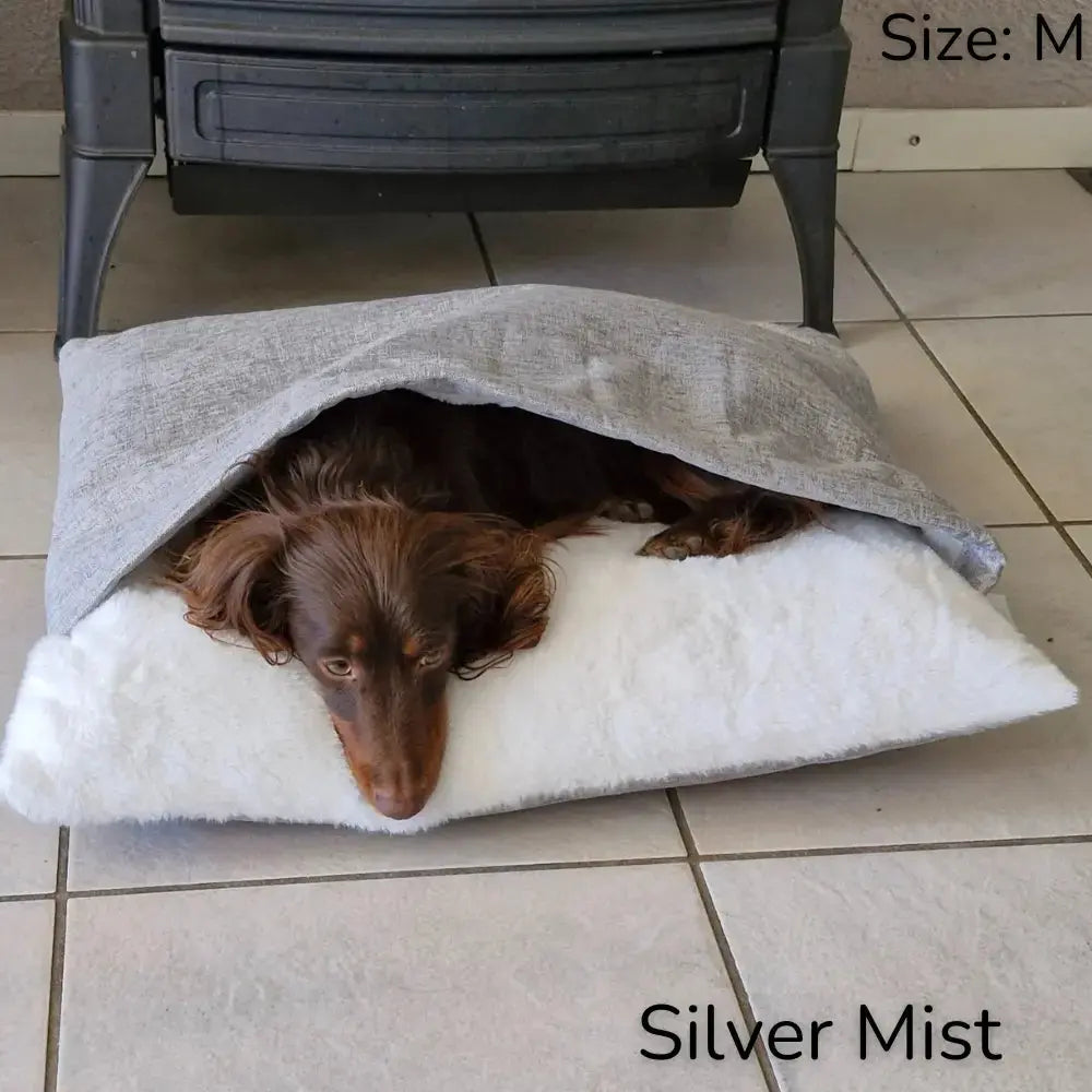 Premium CuddleNest pet bed, a soft dog lounger & cozy burrowing bed offering anxiety relief. Essential dog supplies.