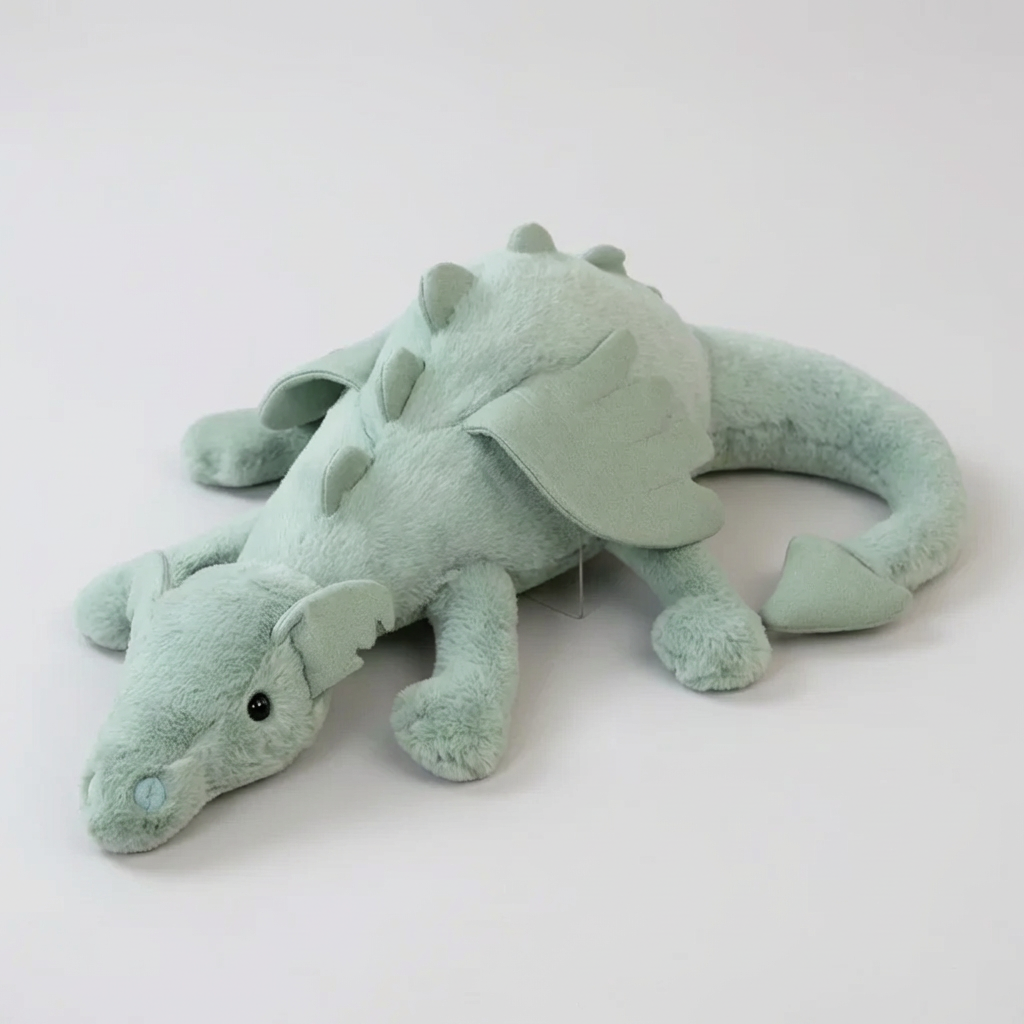 Soft green dragon plush toy for kids, a cuddly stuffed animal perfect as a children's gift or fantasy room decor.