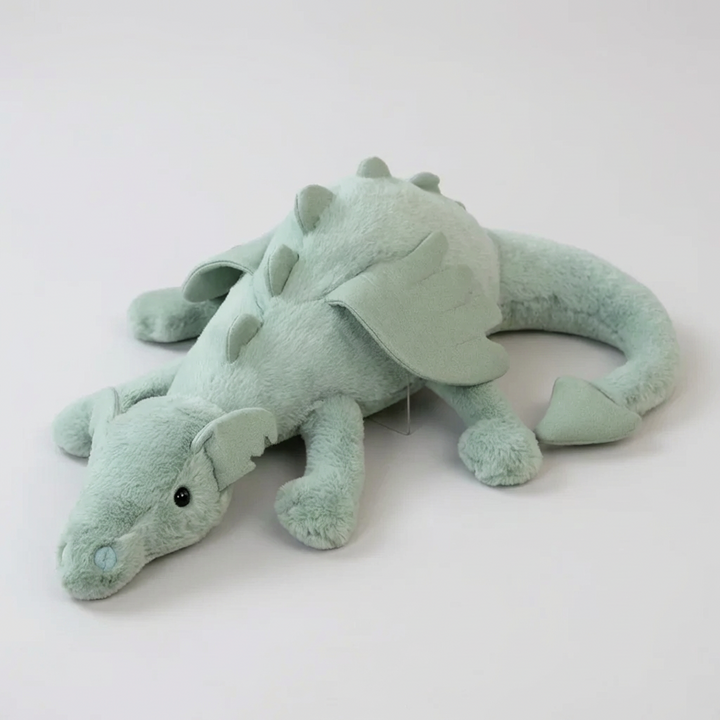 Soft green dragon plush toy for kids, a cuddly stuffed animal perfect as a children's gift or fantasy room decor.