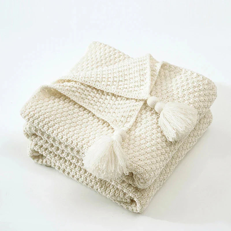 Decorative knitted wool blanket, a stylish tassel throw bringing ultimate comfort and warmth to your living space.