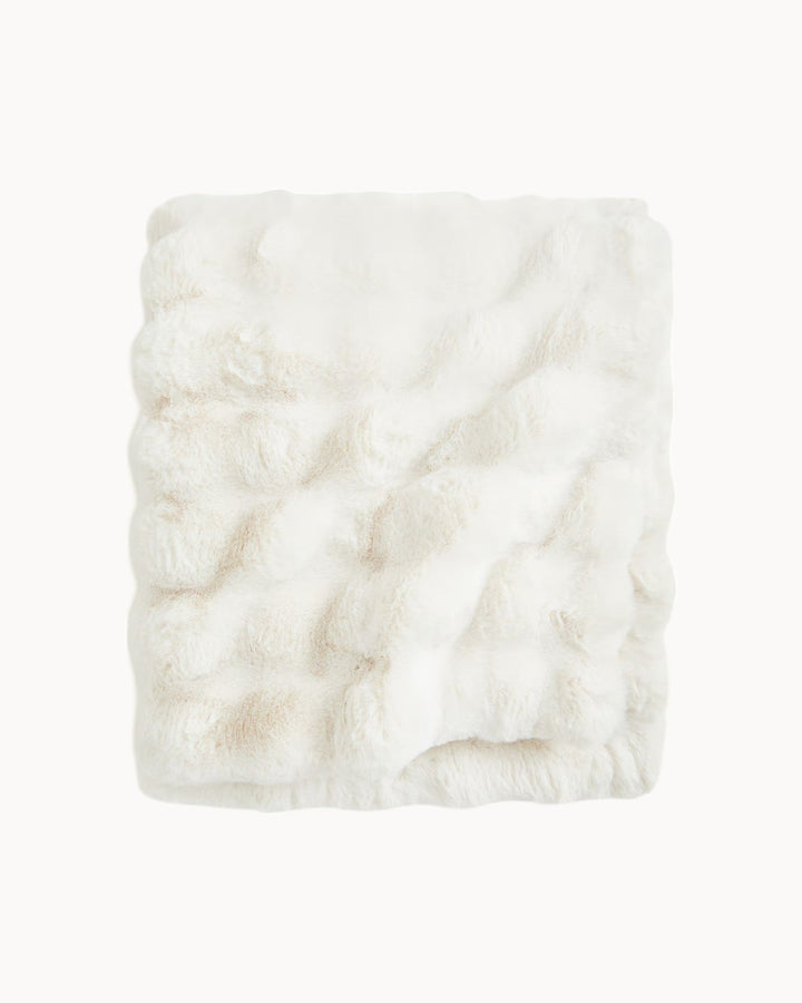 Luxuriously soft fleece throw blanket with classic plaid pattern, ideal for a cozy, warm home decor accent.