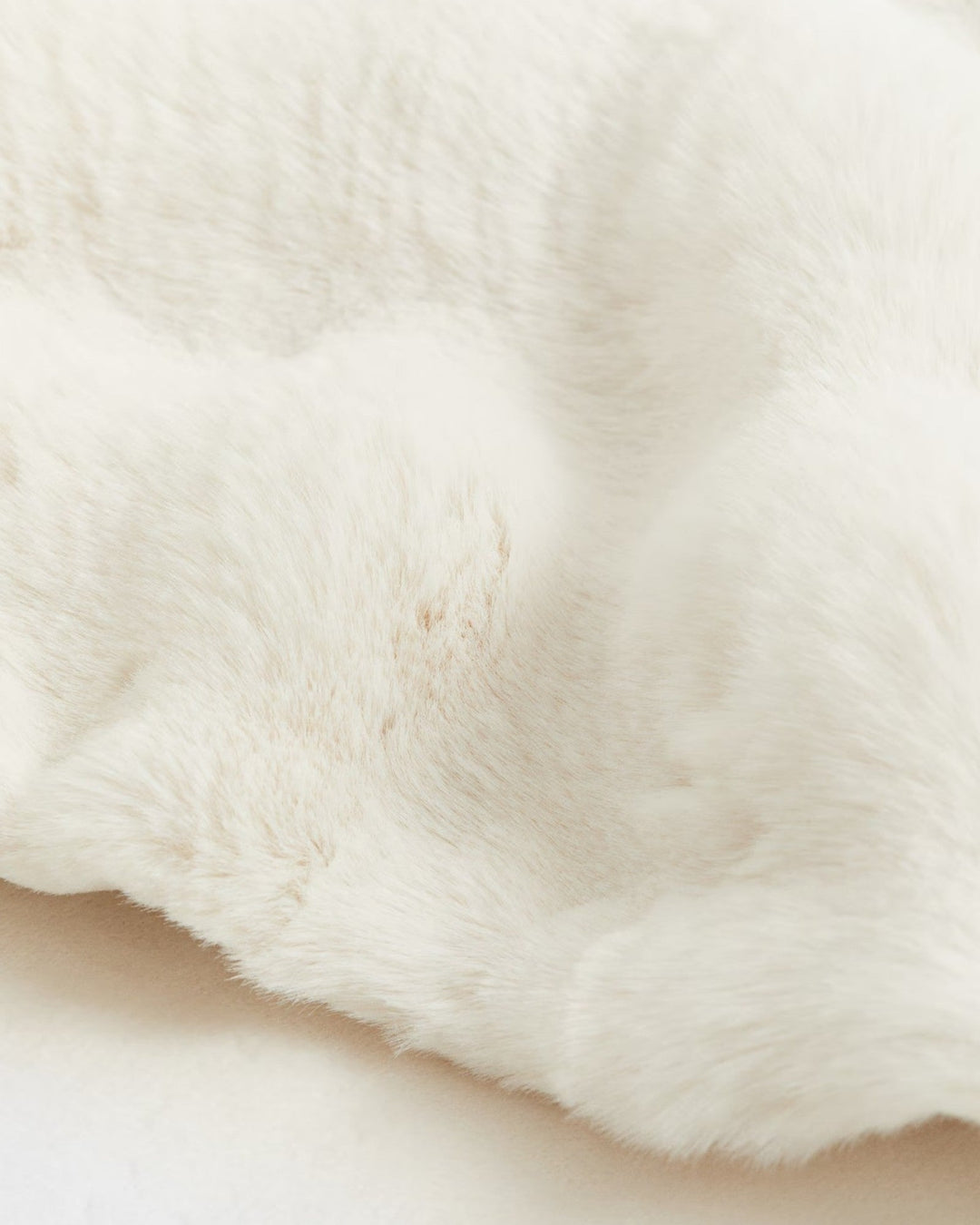 Classic white plaid fleece blanket, incredibly soft and cozy, adding warmth to any sustainable home decor.
