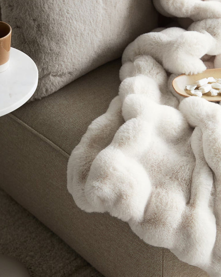 Cozy soft fleece blanket, featuring a timeless plaid design. Sustainable throw for ultimate comfort at home.