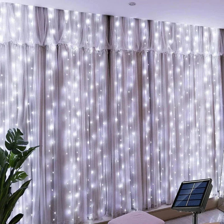"Solar LED curtain light with copper wire, ideal for events, featuring warm white LEDs and solar power, outdoor use."