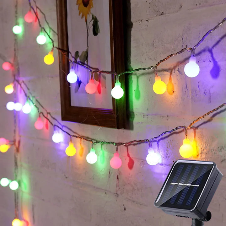 Waterproof LED festoon string lights for durable outdoor garden & patio ambiance, solar-powered.