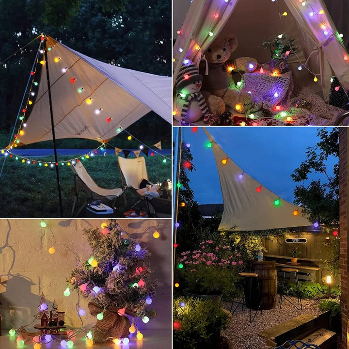 Charming solar festoon string lights draped across a garden, ideal for patio & outdoor decor.