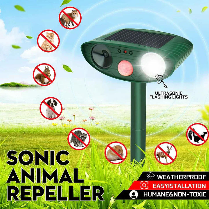 Solar-powered ultrasonic deer repeller with green casing, motion sensor, solar panel, ideal for outdoor garden protection.