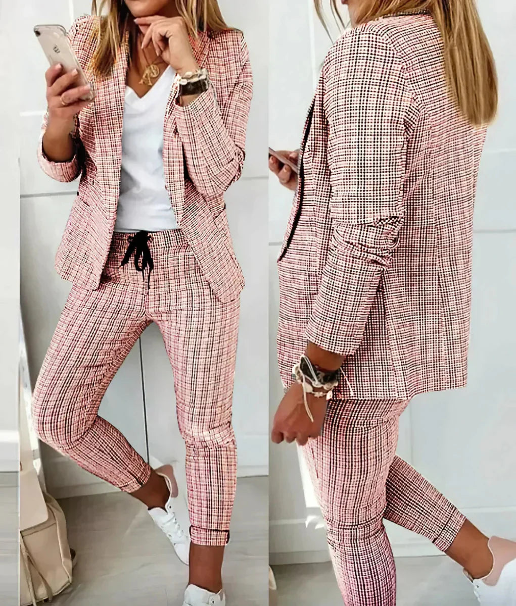 Sophisticated women's two-piece business suit set with jacket & trousers for professional office wear. Elegant formal outfit.