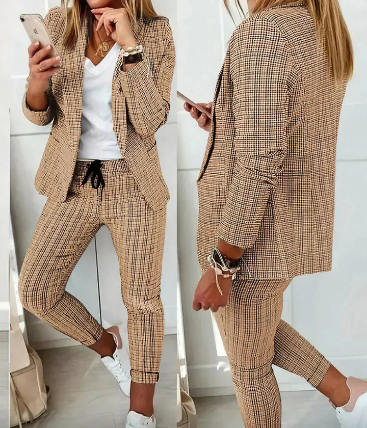 Pink women's professional two-piece pantsuit. Modern, elegant business suit for workwear & office attire.