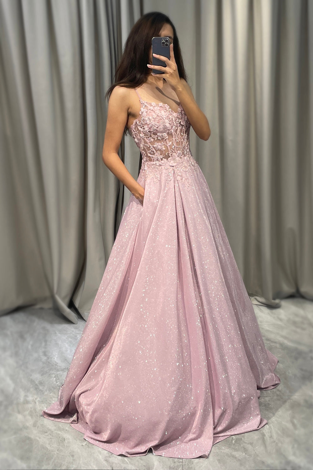 Floor-length sparkling blush A-line gown with spaghetti straps & V-neck. Perfect bridesmaid or wedding guest dress.