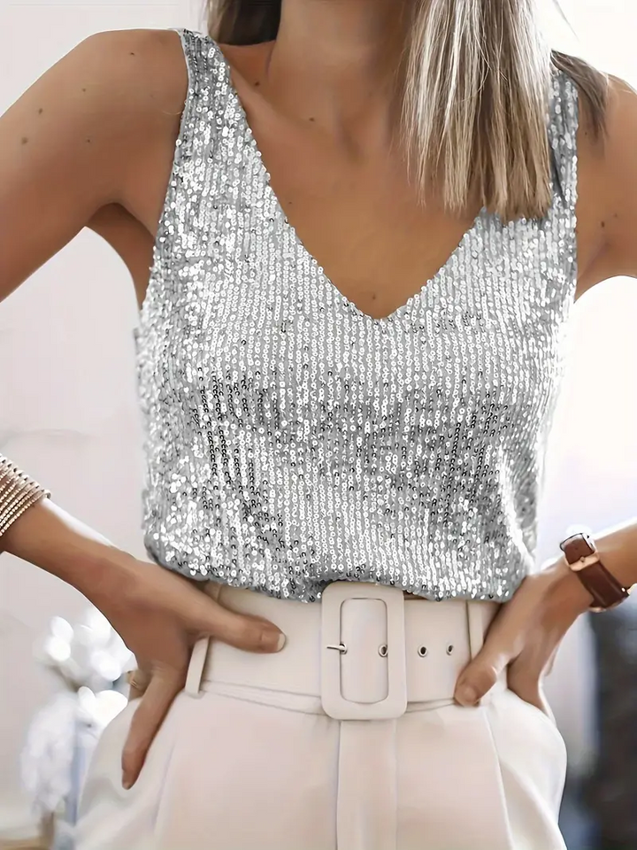 Glamorous women's V-neck sequin sleeveless blouse. Sparkling glitter top, perfect elegant evening fashion wear.