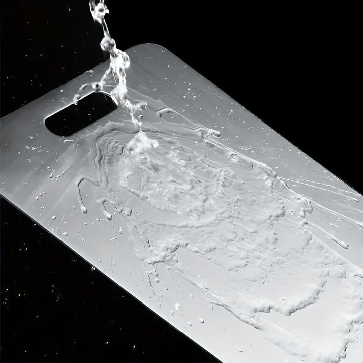"Stainless steel cutting board, non-slip, scratch-resistant surface for hygienic food prep, sleek design for kitchen use."