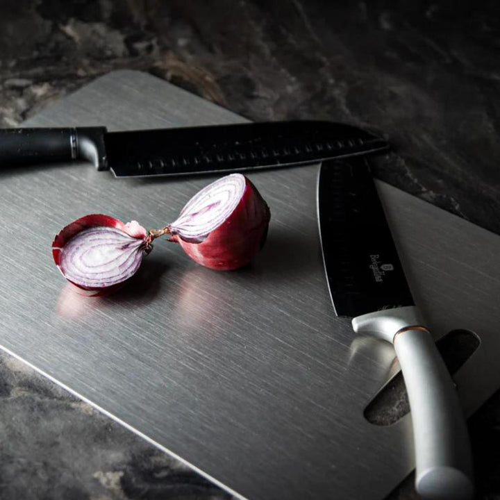 "Stainless steel cutting board, non-slip, scratch-resistant surface for hygienic food prep, sleek design for kitchen use."