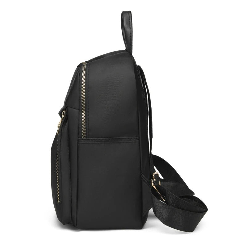 Women's stylish black PU leather backpack featuring adjustable shoulder straps & multiple secure pockets.