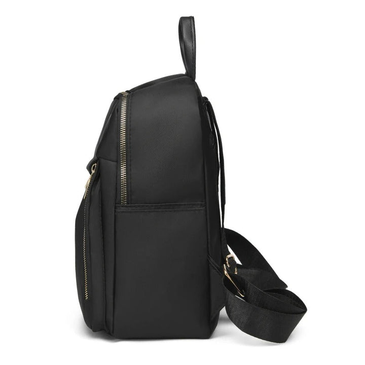 Women's stylish black PU leather backpack featuring adjustable shoulder straps & multiple secure pockets.