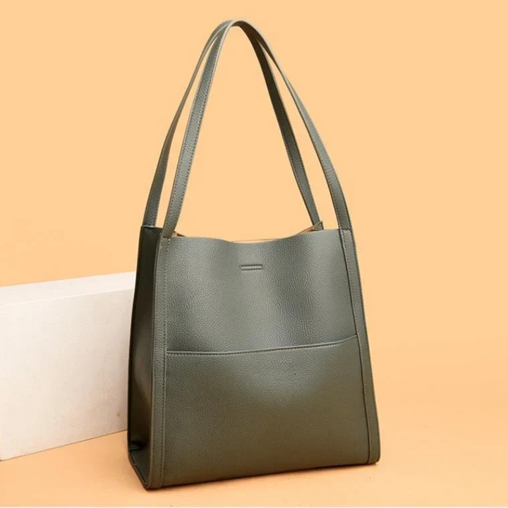Spacious women's leather handbag, ideal large capacity tote for daily essentials, work, or travel.