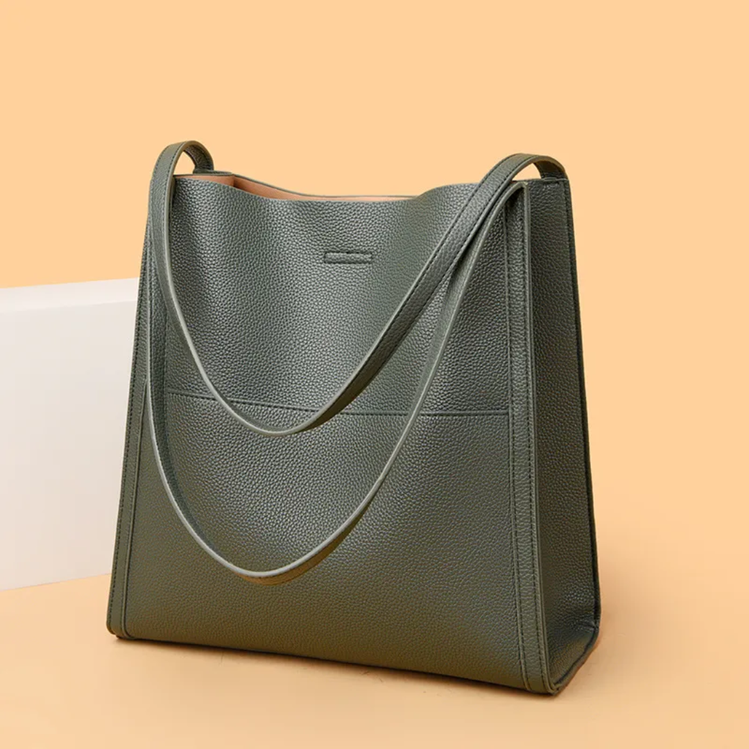 Chic black leather women's shoulder bag. Large capacity tote, perfect for professional work or stylish travel.