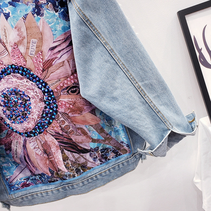 Fashionable Lynn oversized women's denim jacket with an intricate back print design, perfect for modern style.