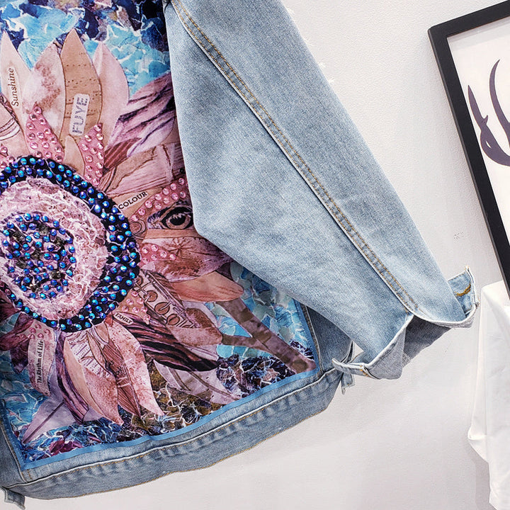 Fashionable Lynn oversized women's denim jacket with an intricate back print design, perfect for modern style.